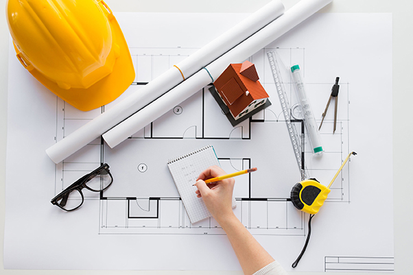 close up of architect hand with blueprint